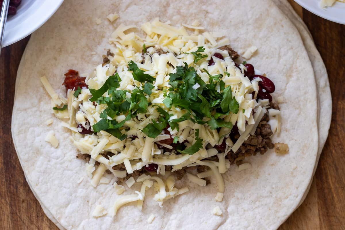 grated cheese and coriander is added to beef filling